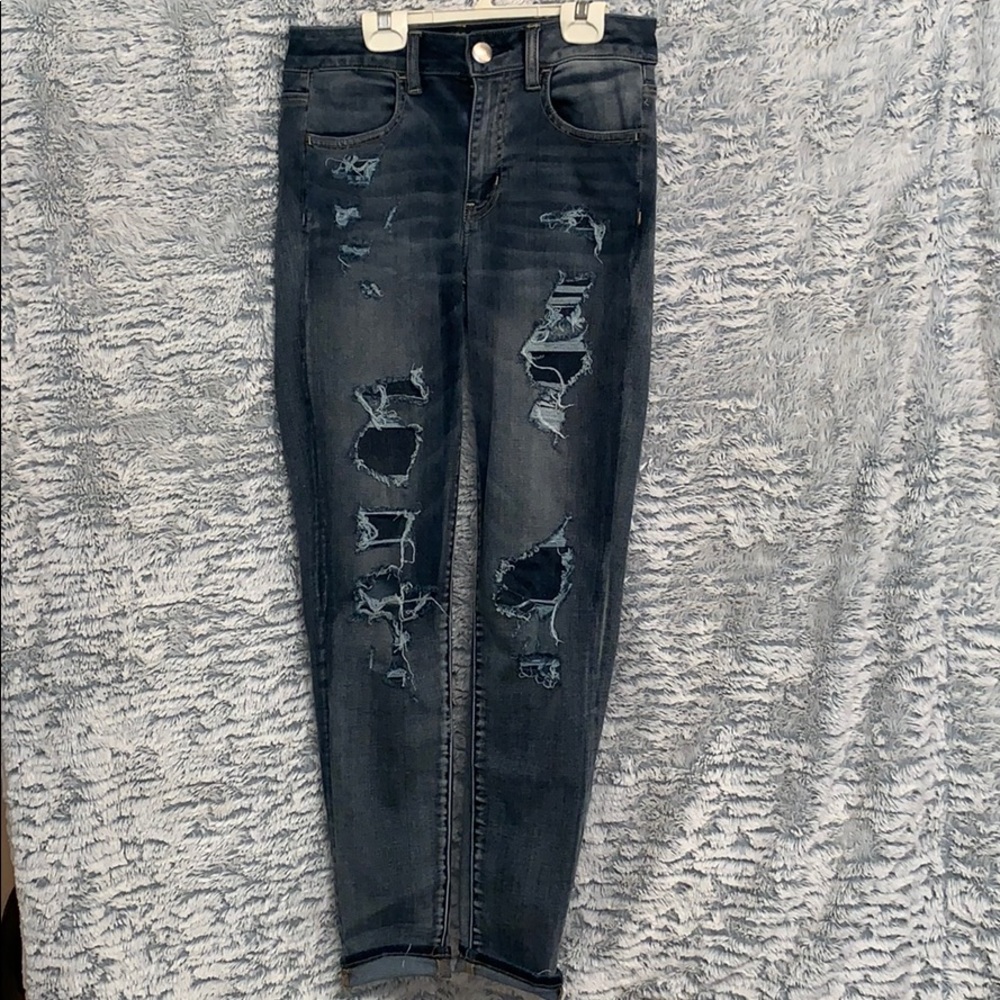 Dark distressed denim jeans